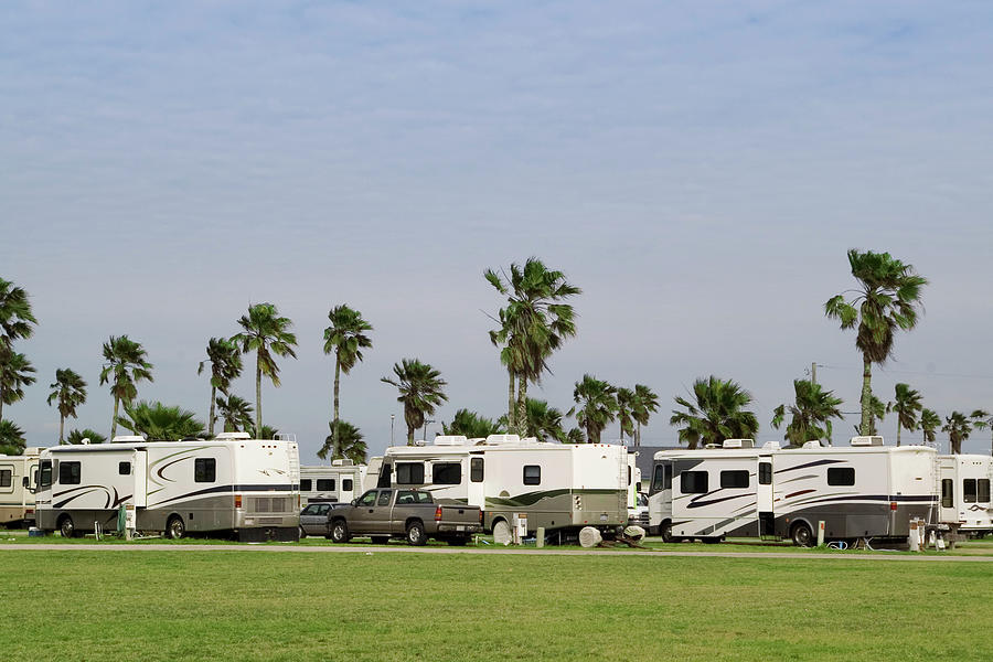 An Rv Park With The Same Rvs All In A Photograph by Josephbrewster