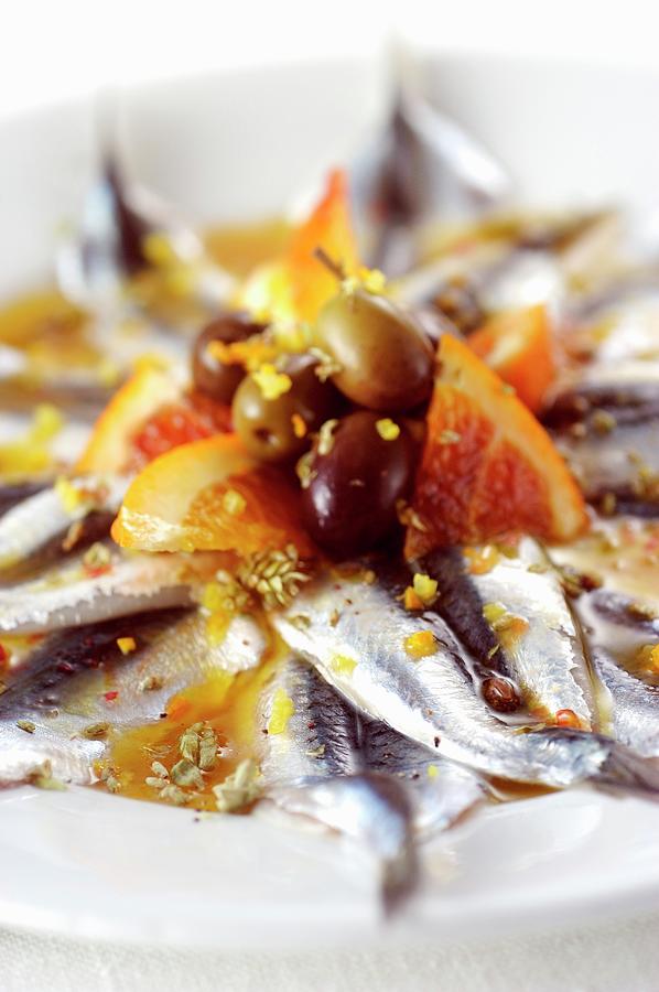 Anchovies In An Orange Marinade With Pink Pepper And Olives Photograph by Franco Pizzochero