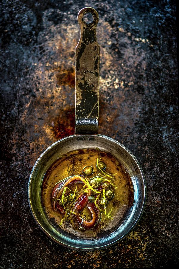 Anchovies With Capers In Olive Oil Photograph by Roger Stowell