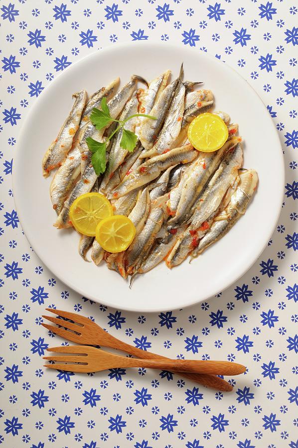 Anchovies With Lemon Slices On A Plate Photograph by Jean-christophe Riou