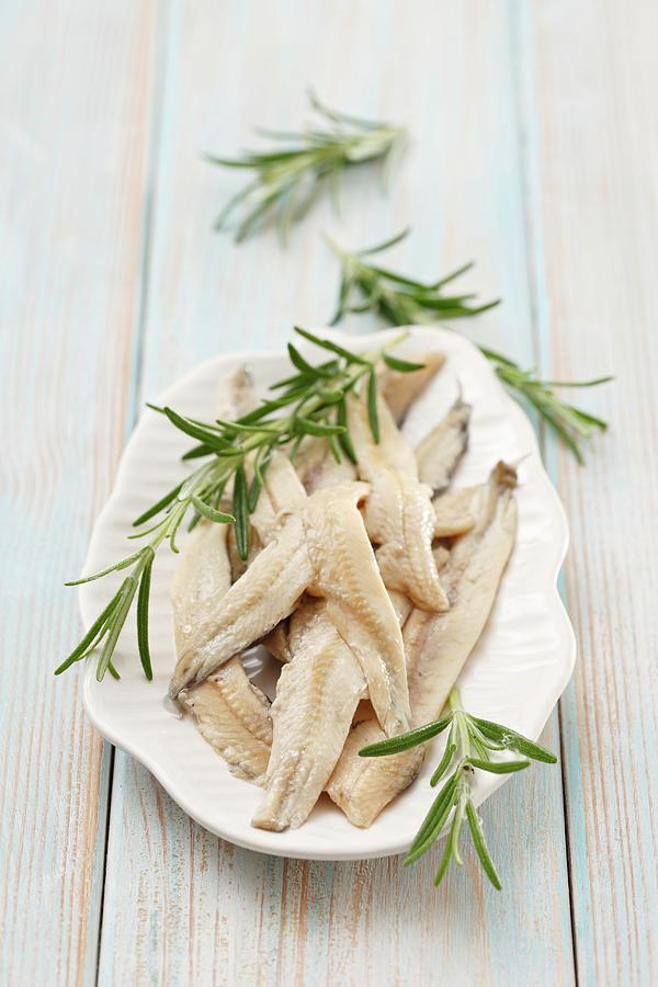 Anchovy Fillets In Oil With Fresh Rosemary Photograph by Petr Gross