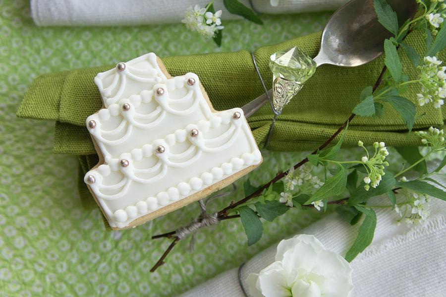 And Napkins Decorated With A Rhinestone, A Wedding Cake Shaped Biscuit, Spirea, And A Matthiola Flower Photograph by Martina Schindler