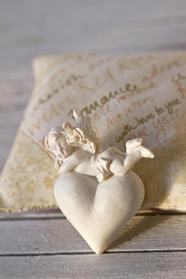 Angel And Heart Decoration On Scented Sachet Photograph by Uwe Merkel