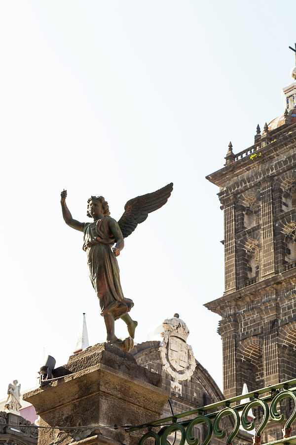 Architecture Photograph - Angel Statue And The Cathedral Of Puebla City, Mexico by Cavan Images