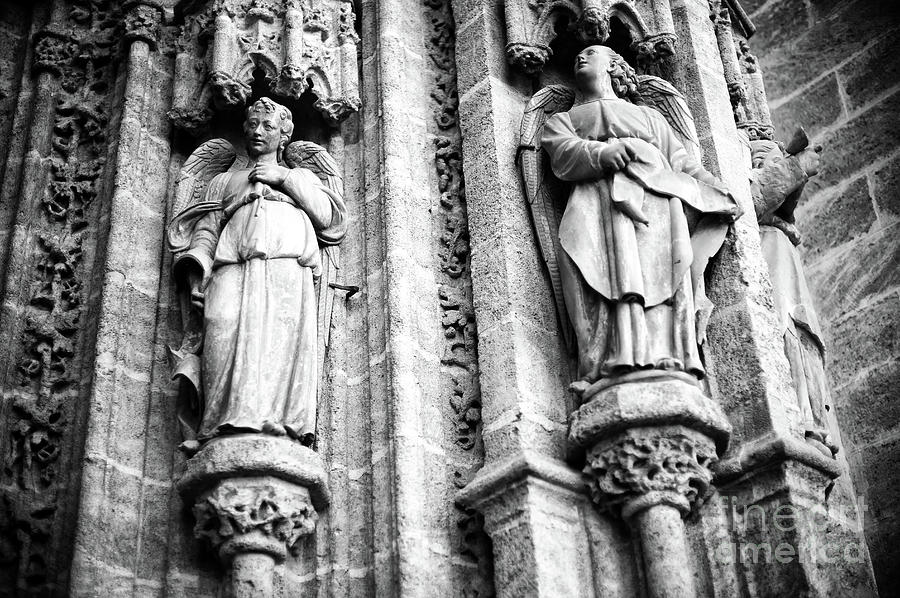 Angels at the Seville Cathedral Photograph by John Rizzuto