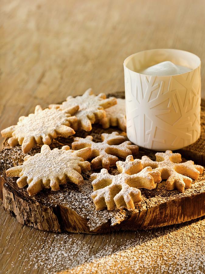 Anise And Marzipan Snowflakes With Icing Sugar Photograph by Manfred Jahrei