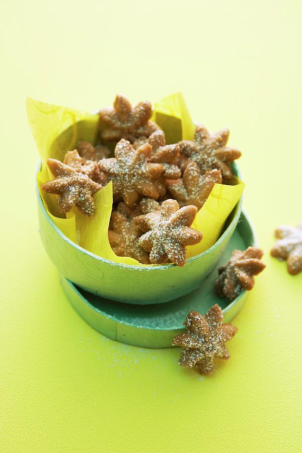 Aniseed Stars Dusted With Icing Sugar Photograph by Michael Wissing