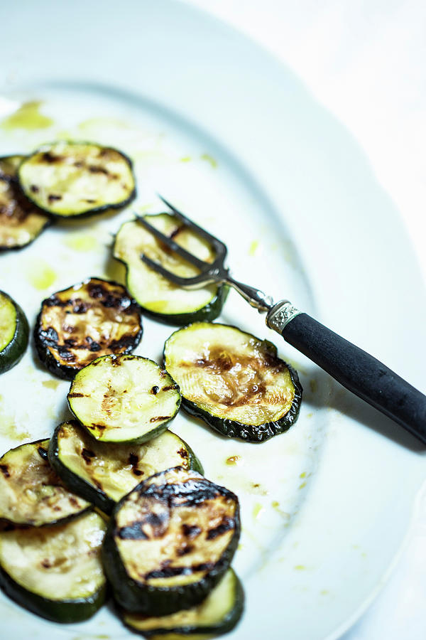 Antipasti Of Grilled Zucchini, Marinated With Olive Oil And Herbs Photograph by Charlotte Von Elm