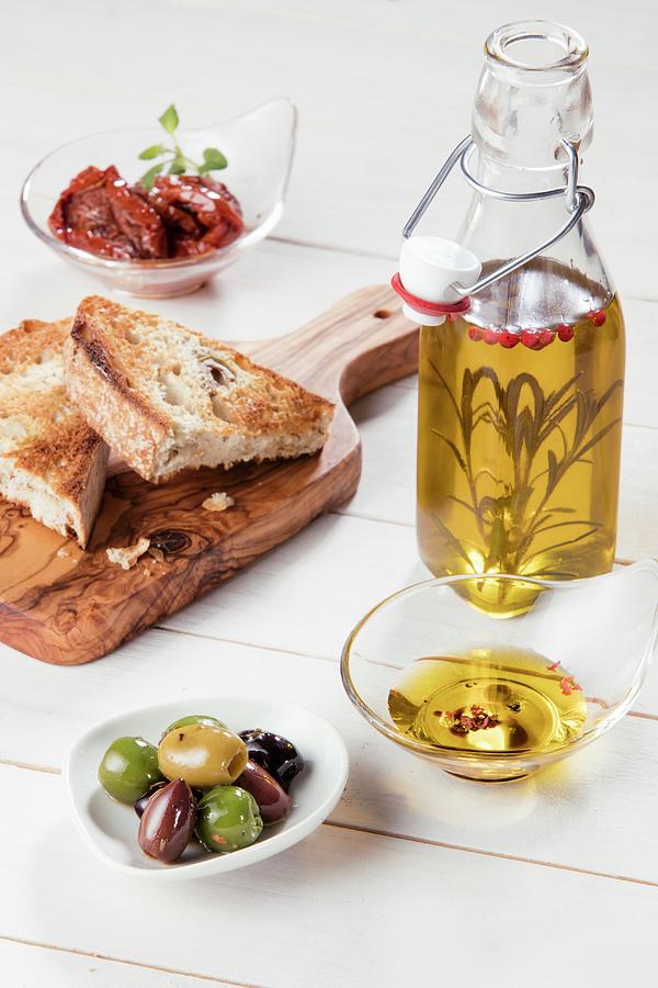 Antipasti: Olives, Dried Tomatoes, Olive Oil And Grilled Bread italy Photograph by Younes Stiller