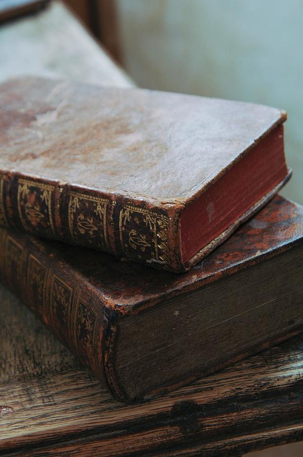 Antiquarian Books With Gilt Embossing On Worn Leather Bindings ...