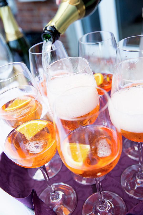 Aperol Being Topped Up With Champagne Photograph by Claudia Timmann