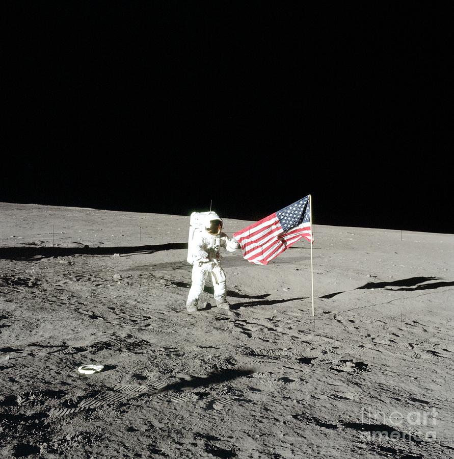 Apollo 12 Commander Unfurling Us Flag Photograph by Nasa/science Photo Library