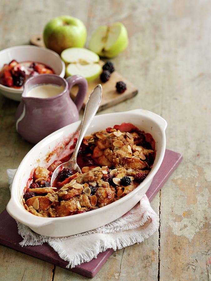 Apple And Blackberry Crumble With Almond Flakes Photograph by Gareth Morgans
