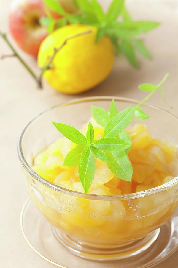 Apple And Lemon Compote With Lemon Balm Photograph by Hilde Mche