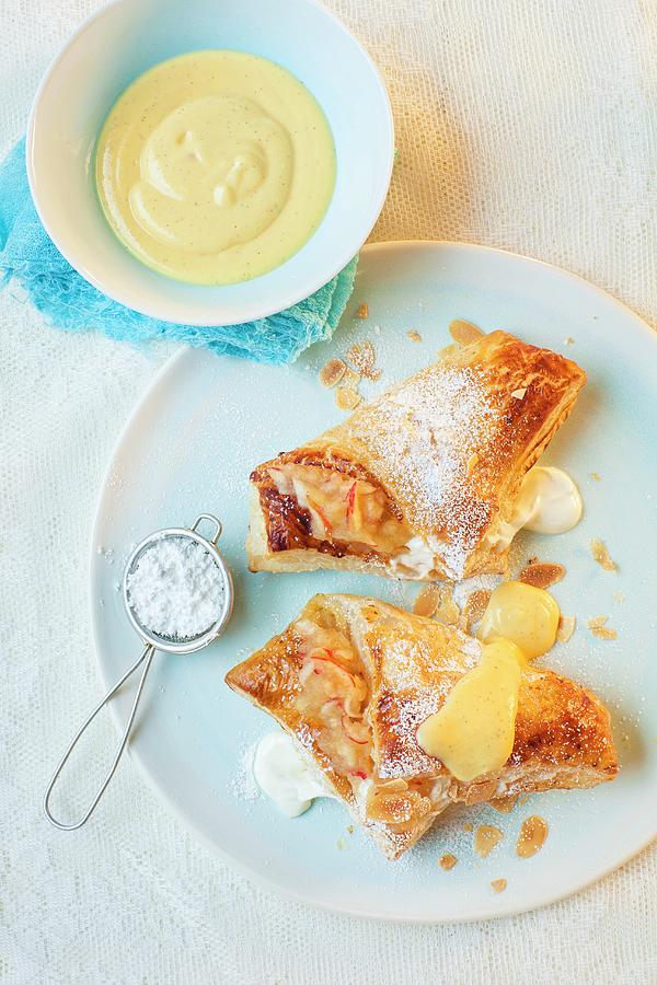 Apple And Quark Turnovers With Icing Sugar And Custard Photograph by Stephanie Gayer