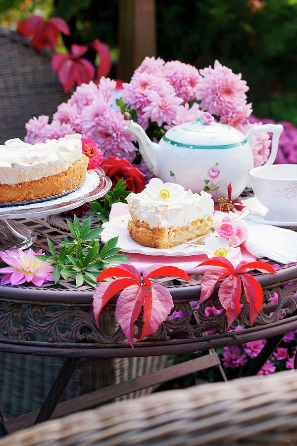 Apple Cake, Flowers And Autumn Leaves On A Garden Table Photograph by Angelica Linnhoff