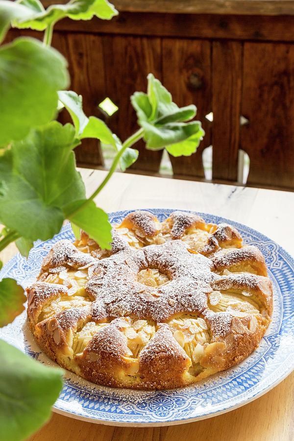 Apple Cake With Flaked Almonds And Icing Sugar Photograph by Anneliese Kompatscher
