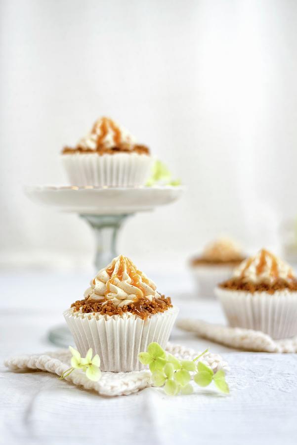 Apple Caramel Cupcakes With Streusel, Buttercream Frosting And Caramel Sauce Photograph by Lucy Parissi
