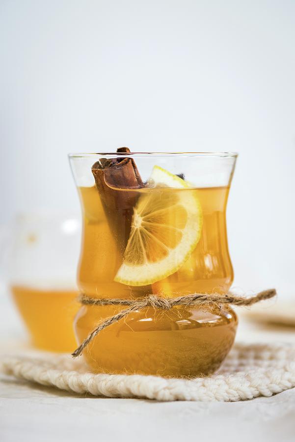 Apple Cider With A Cinnamon Stick, Lemon, Honey And Apple Vinegar Photograph by Lucy Parissi