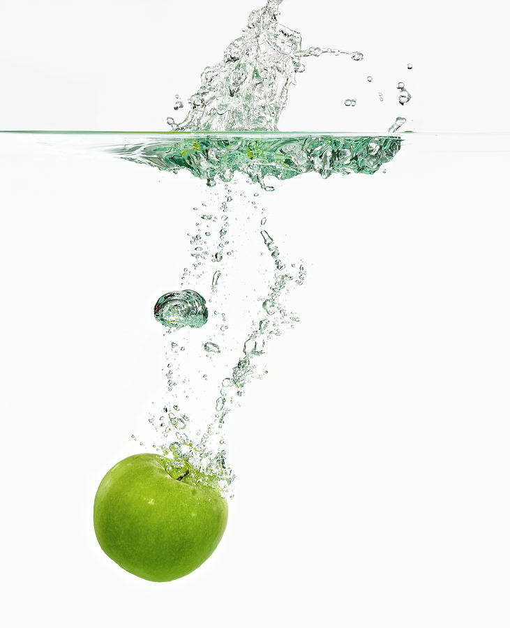 Apple Dropping In Water Photograph by Mark Mawson