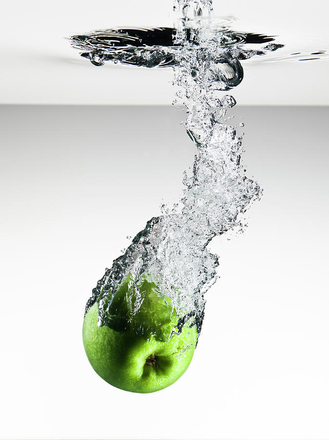 Apple Falling Into Water Photograph by Pier