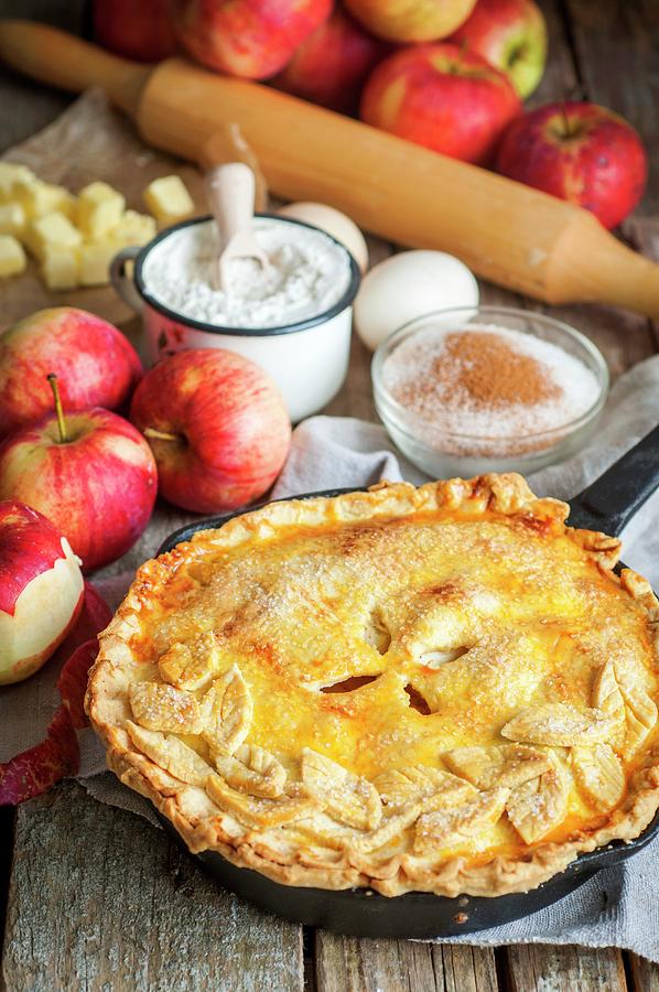 Apple Pie With A Pastry Topping, Surrounded By The Ingredients Photograph by Irina Meliukh