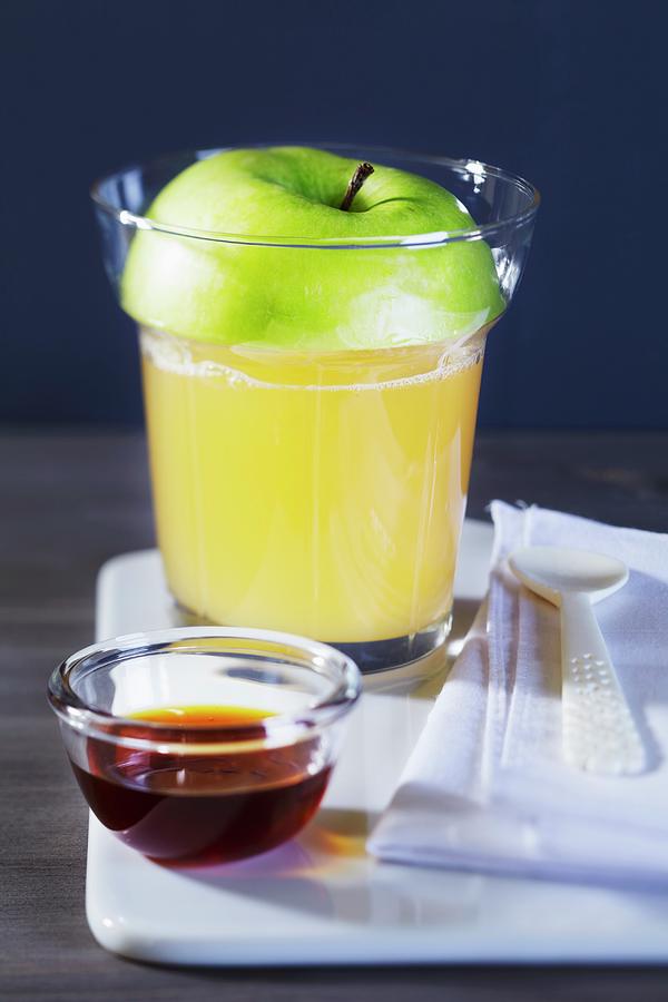 Apple Punch In A Glass With A Slice Of Apple As A Lid Photograph by Taube, Franziska