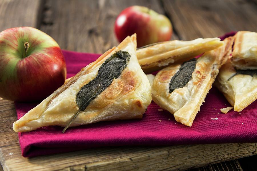 Apple Turnovers With Sage Leaves Photograph by Monika Halmos