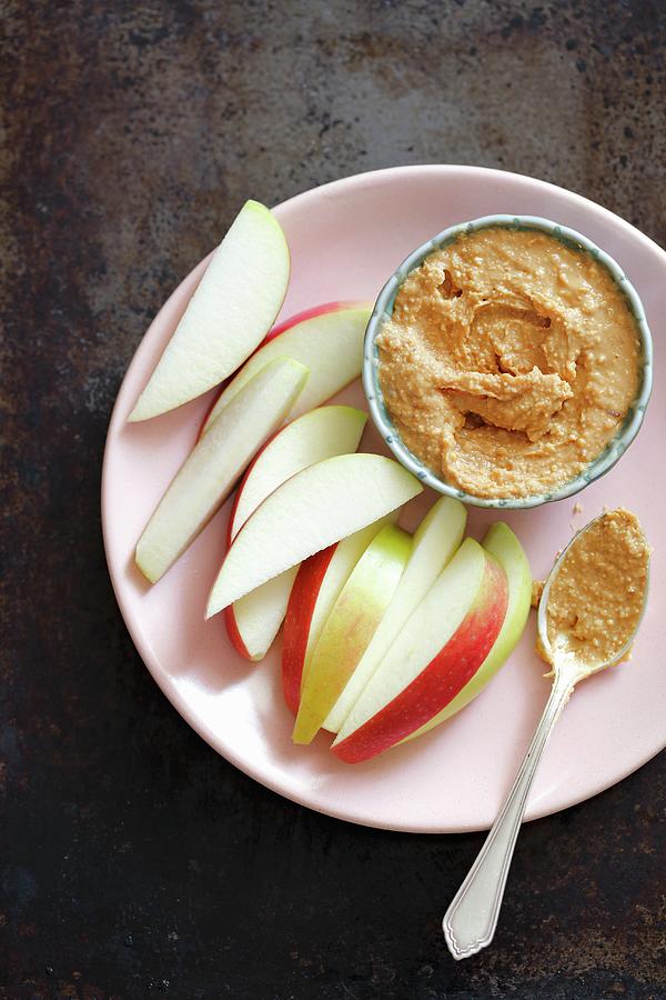 Apple Wedges With Peanut Butter For Dipping Photograph by Rua Castilho