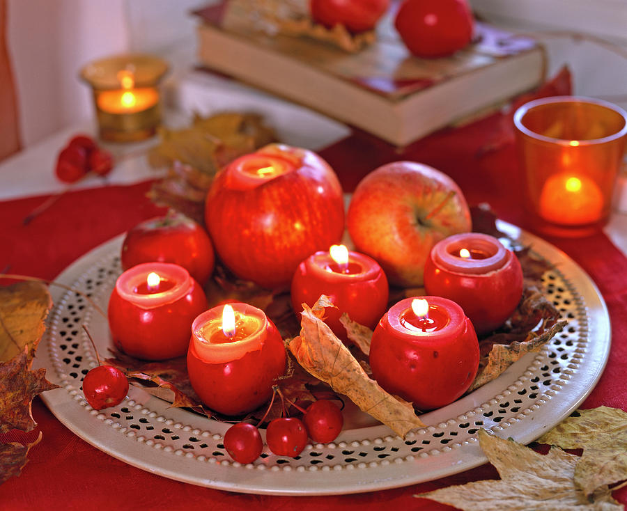 Apples As Tealight Holder On Metal Dish Photograph by Friedrich Strauss