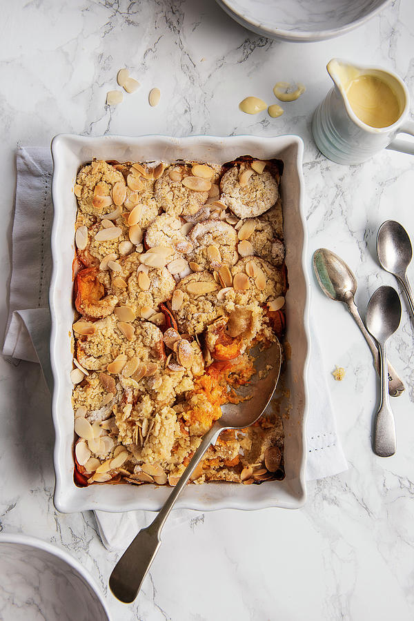 Apricot And Almond Crumble With Custard Photograph by Magdalena Hendey