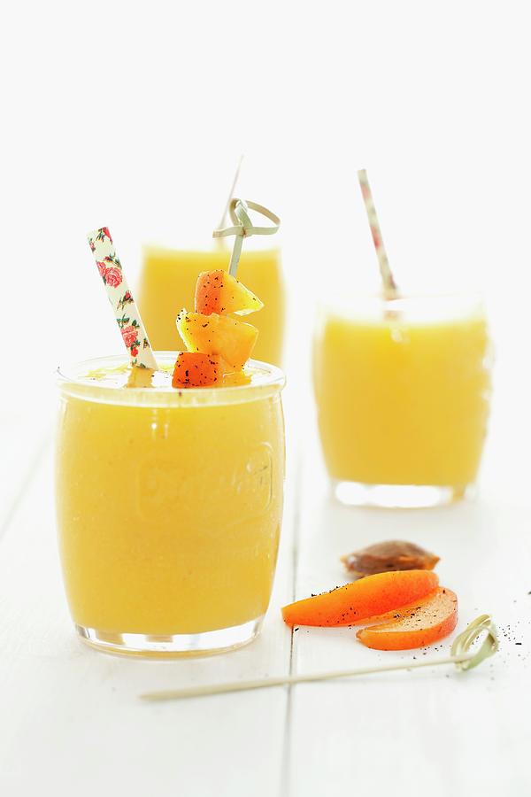 Apricot And Mango Smoothies Photograph by Jane Saunders
