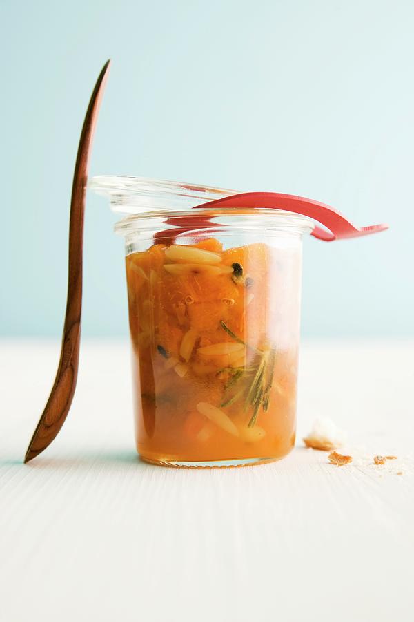 Apricot And Passion Fruit Chutney With Rosemary And Almonds Photograph by Michael Wissing