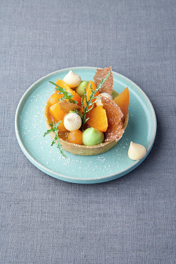 Apricot And Pistachio Tartlet With Rocket Photograph by Michael Wissing