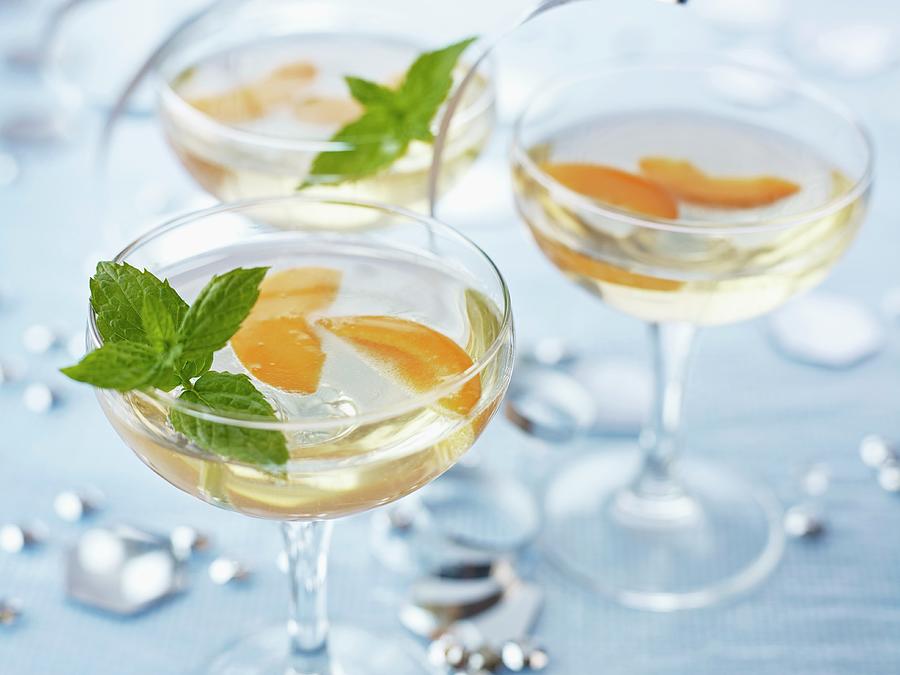 Apricot Fizz Garnished With Mint Leaves Photograph by Vincent Noguchi Photography