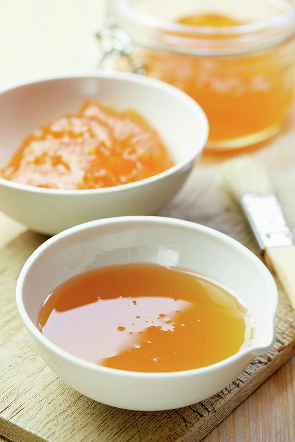 Apricot Jam And Honey In Porcelain Bowls Photograph by Jonathan Short