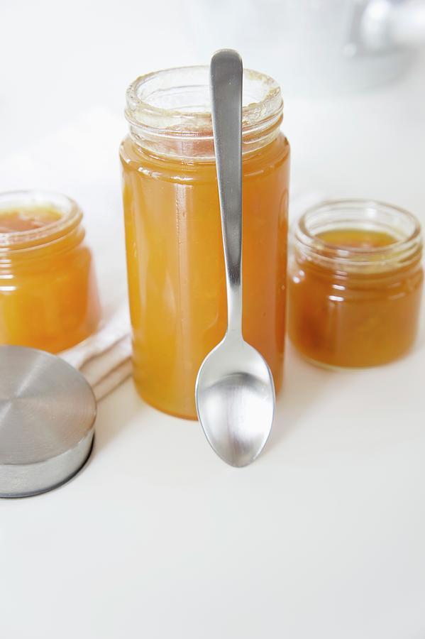 Apricot Jam With Ginger In Jam Jars Photograph by Martina Schindler