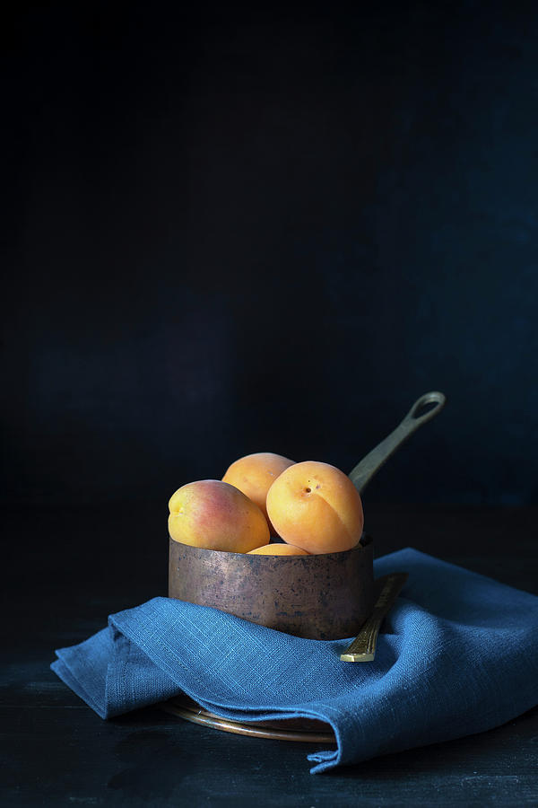 Apricots In A Saucepan Photograph by Alice Del Re