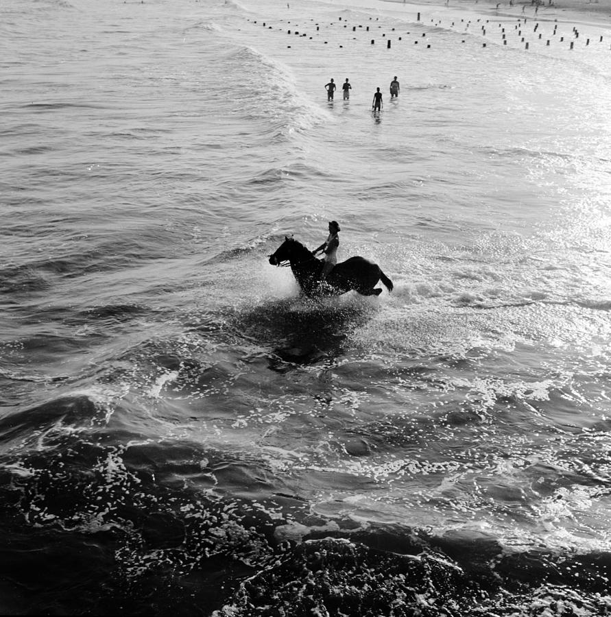 Black And White Photograph - Aquatic Equestrian by Three Lions