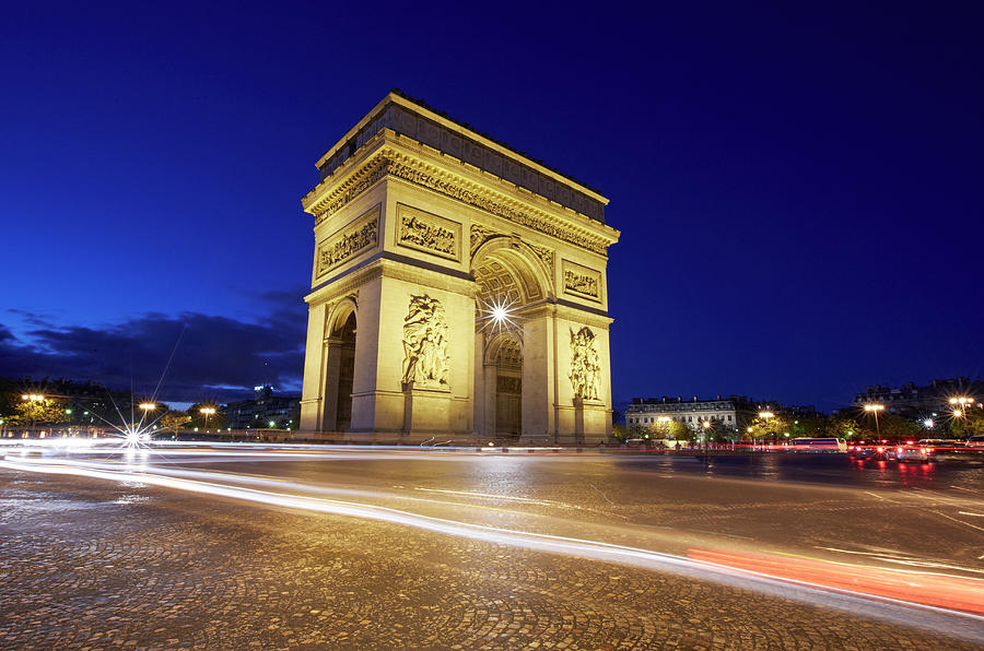 Arc De Triomphe At Night Photograph by Allan Baxter