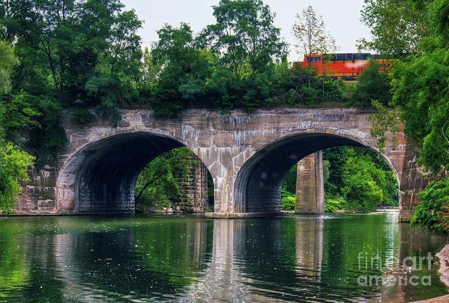 Arched train Bridge   Photograph by Jim Lepard