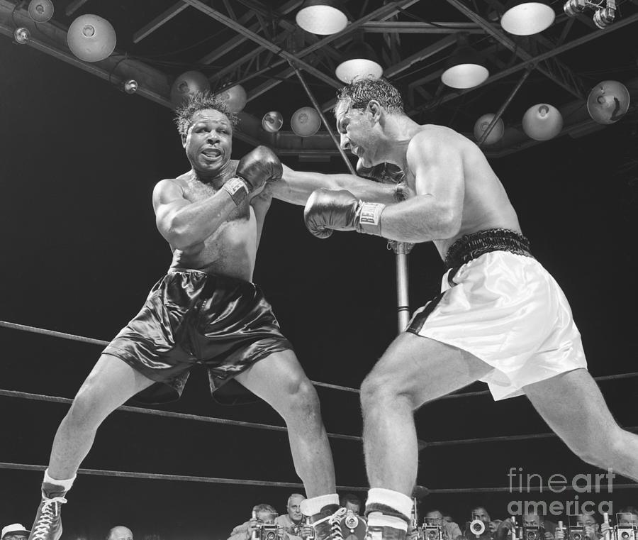 Archie Moore Punching Rocky Marciano Photograph by Bettmann
