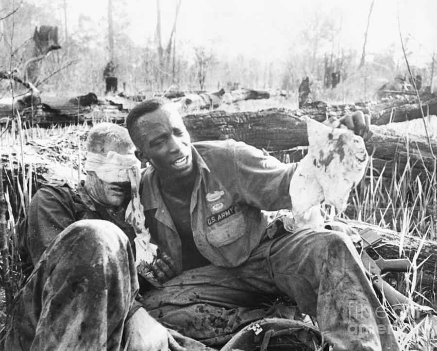 Army Medic With Wounded Comrade Photograph by Bettmann