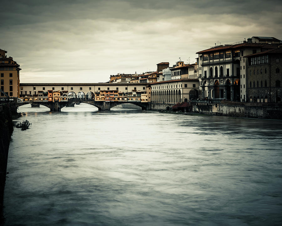 Arno River And Ponte Vecchio Bridge In Photograph by Giorgiomagini