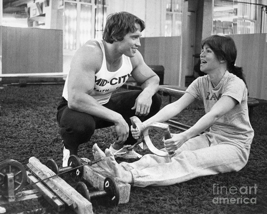 Arnold Schwarzenegger Photograph - Arnold Schwarzenegger Training Sally by Bettmann