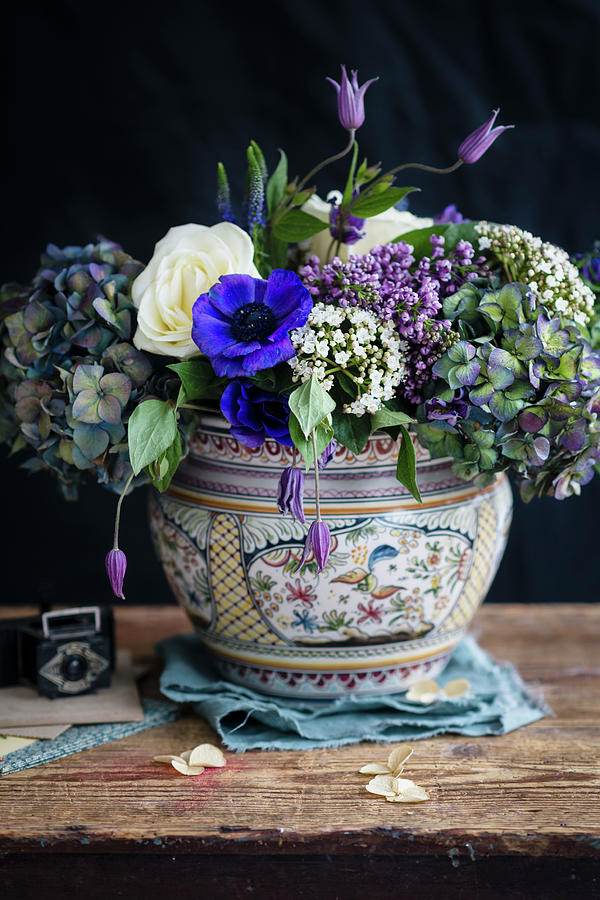 Arrangement Of Blue, Purple And White Flowers In China Vase Against Black Background Photograph by Lucy Parissi