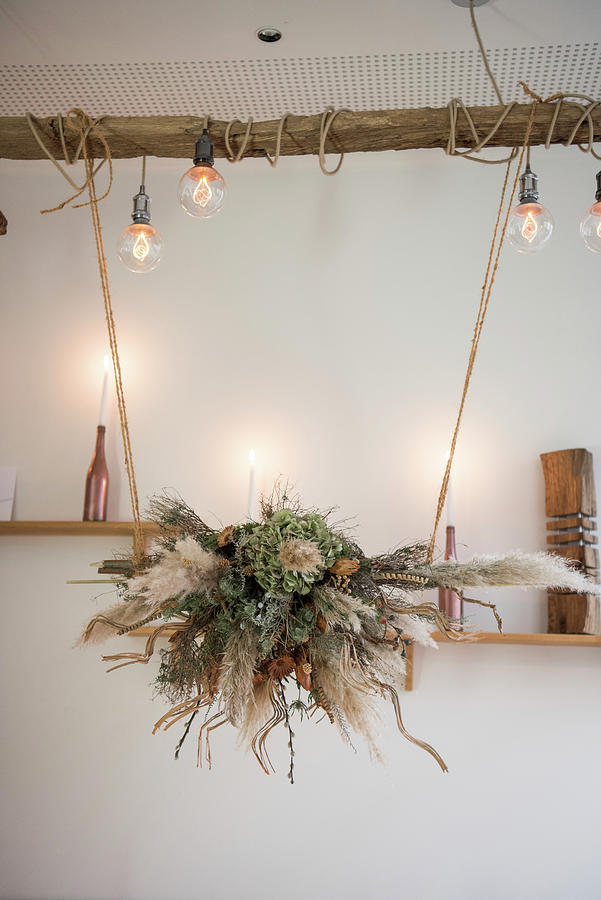 Arrangement Of Dried Flowers Suspended Over Table Photograph by Jelena Filipinski
