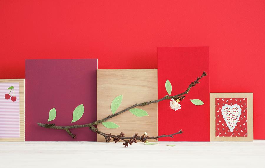Arrangement Of Flowering Cherry Branch And Wooden Boards With Various Designs Photograph by Studio27neun