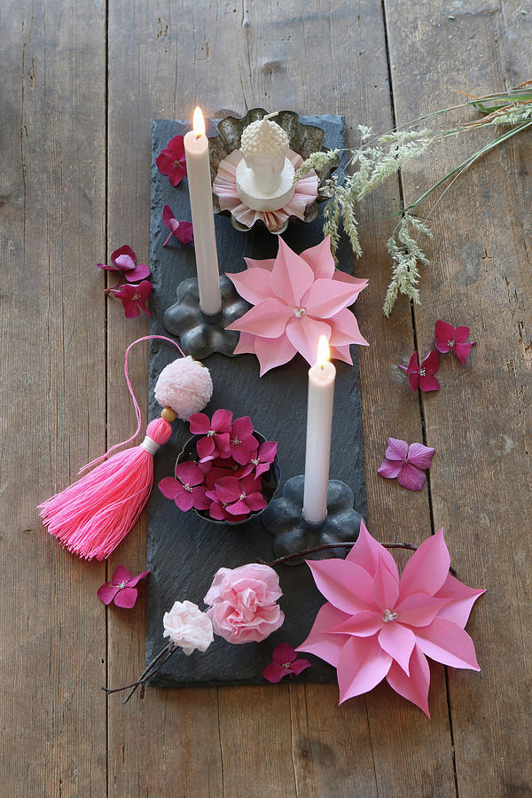 Arrangement Of Paper Flowers And Grey Candles On Slate Board Decorating Tablw Photograph by Regina Hippel