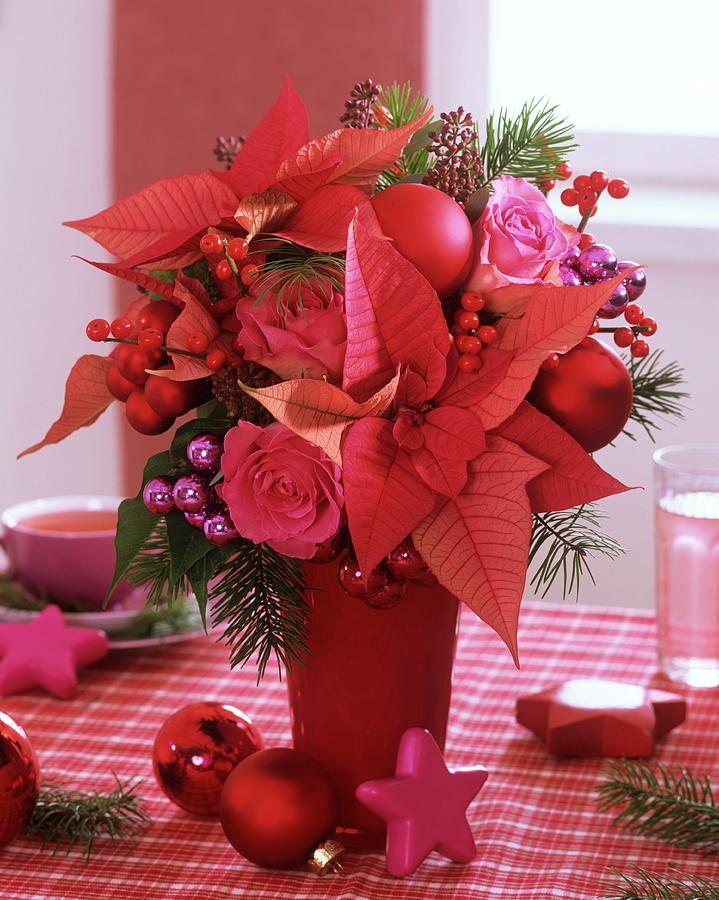 Arrangement Of Poinsettia, Roses, Ilex Berries And Baubles Photograph by Friedrich Strauss